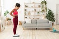 Frustrated Black Girl Standing On Weight-Scales At Home Royalty Free Stock Photo