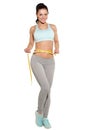 Weight loss, sports girl measuring her waist Royalty Free Stock Photo