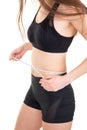 Weight loss for sports girl measuring her waist training in the gym workout abdominals Royalty Free Stock Photo