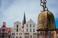 Weight of old Crane hanging in front of facade of historical buildings in Harbor Lueneburg, Lower Saxony,Germany Royalty Free Stock Photo