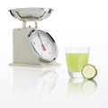 weight scale with cucumber juice glass isolated on white background, Balanced diet conceptt Royalty Free Stock Photo