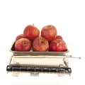 Weight scale fresh apples isolated over white background Royalty Free Stock Photo