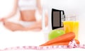 Weight scale and orange juice with green apple and carrot Royalty Free Stock Photo