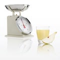 weight scale with pear juice glass isolated on white background, Balanced diet conceptt Royalty Free Stock Photo