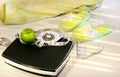 Weight scale on tile floor with towel and slippers Royalty Free Stock Photo