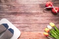 Weight scale white digital with women feet standing on scale and diet red apple bind with measuring tape on the wooden backgrounds Royalty Free Stock Photo