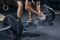 Weightlifter clapping hands before barbell workout at gym Royalty Free Stock Photo