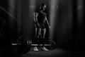 The weightlifter is preparing to perform an exercise called dead Royalty Free Stock Photo