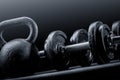 Weights and dumbbells on a black background