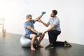 Weights, physiotherapy and help with doctor and old man for rehabilitation, training or stretching. Healthcare, wellness Royalty Free Stock Photo
