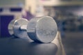 weights. Shallow depth of field, blurred foreground, focused lighting on weights for emphasis. dramatic lighting. blurred Royalty Free Stock Photo