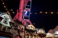 Weihnachtsmarkt, annual Christmas market with colourful decorated stalls and giant ferris wheel.