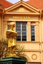 Weimar, Germany - April 7, 2024: Buergerschulbrunnen fountain with golden boy reading a book, near Music school named after Johann