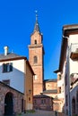 Weinheim, Germany - Clock tower of catholic St. Laurentius church in front of blue sky