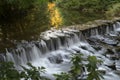Weir in full flow. Royalty Free Stock Photo
