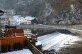 Weir on river Vltava in Cesky Krumlov in winter Royalty Free Stock Photo