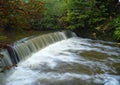 A weir on a small stream Royalty Free Stock Photo