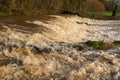 The weir at Tipton St John on the River Otter at fiull force with all the rain dropped by Storm Gareth Royalty Free Stock Photo