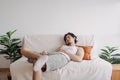 Weird and funny sleep pose of man in his apartment in boring day off.