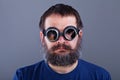 Weird guy with matted hair and large beard wearing broken welding goggles Royalty Free Stock Photo