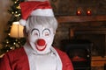 Weird looking clown dressed as Santa Claus for Christmas time Royalty Free Stock Photo