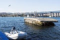 A weird shaped concrete pier and marina and a boat in golden horn in istanbul, turkey Royalty Free Stock Photo