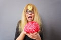 Weird woman holding brain having idea Royalty Free Stock Photo