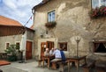 Elderly people sitting at a table in a street restaurant. Weissenkirchen in der Wachau, Austria.