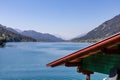 Weissensee - Wooden rood if house with scenic view of east bank of alpine lake Weissensee in Gailtal Alps Royalty Free Stock Photo