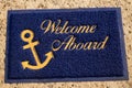 Welcome aboard blue mat. Beach cafe, yacht club Wellcome concept