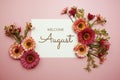 Welcome August typography text with LED cotton ball on pink background Royalty Free Stock Photo