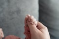 Welcome baby,Mother holding her newborn baby by little hand Royalty Free Stock Photo