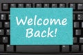 Welcome Back message on a greeting card on black keyboard Royalty Free Stock Photo