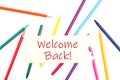 Welcome back message on wood sign with colored watercolor pencils