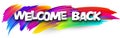Welcome back paper word sign with colorful spectrum paint brush strokes over white Royalty Free Stock Photo