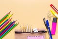 Welcome back to school background, colorful color pencil and stationery bag on yellow backgrounds with copy space Royalty Free Stock Photo