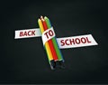 Welcome back to school embroidered on ribbon on colorful crayons Royalty Free Stock Photo