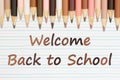 Welcome Back to School message with multiculture skin tone color pencils Royalty Free Stock Photo