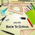 Welcome back to school with school supplies on notebook paper