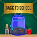 Welcome back to school with stationary, bag, apple on the table with green chalkboard template Royalty Free Stock Photo