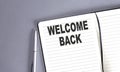 WELCOME BACK word on the notebook with pen Royalty Free Stock Photo