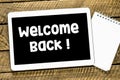 Welcome Back words on the screen of the tablet Royalty Free Stock Photo