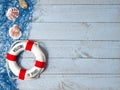 Welcome on Board - lifebuoy with text and shells on wooden background