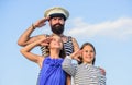 Welcome on board. small girls marine fashion. parenting discipline. sea cruise. have good swim. bearded sailor with kids