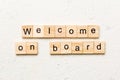 welcome on board word written on wood block. welcome on board text on table, concept Royalty Free Stock Photo