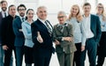 welcome businessman standing in front of a big business team. Royalty Free Stock Photo