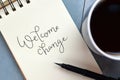 WELCOME CHANGE hand-lettered in notepad