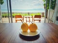 Welcome fruit in the hotel bedroom with terrace and sea beach in background Royalty Free Stock Photo
