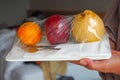 Welcome fruit in hotel room with pear apple and orange ready to eat with silver knife and fork