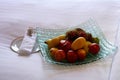 Welcome fruit platters on a bed in hotel room.